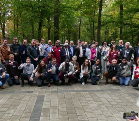 The SophiA project consortium poses in front of trees